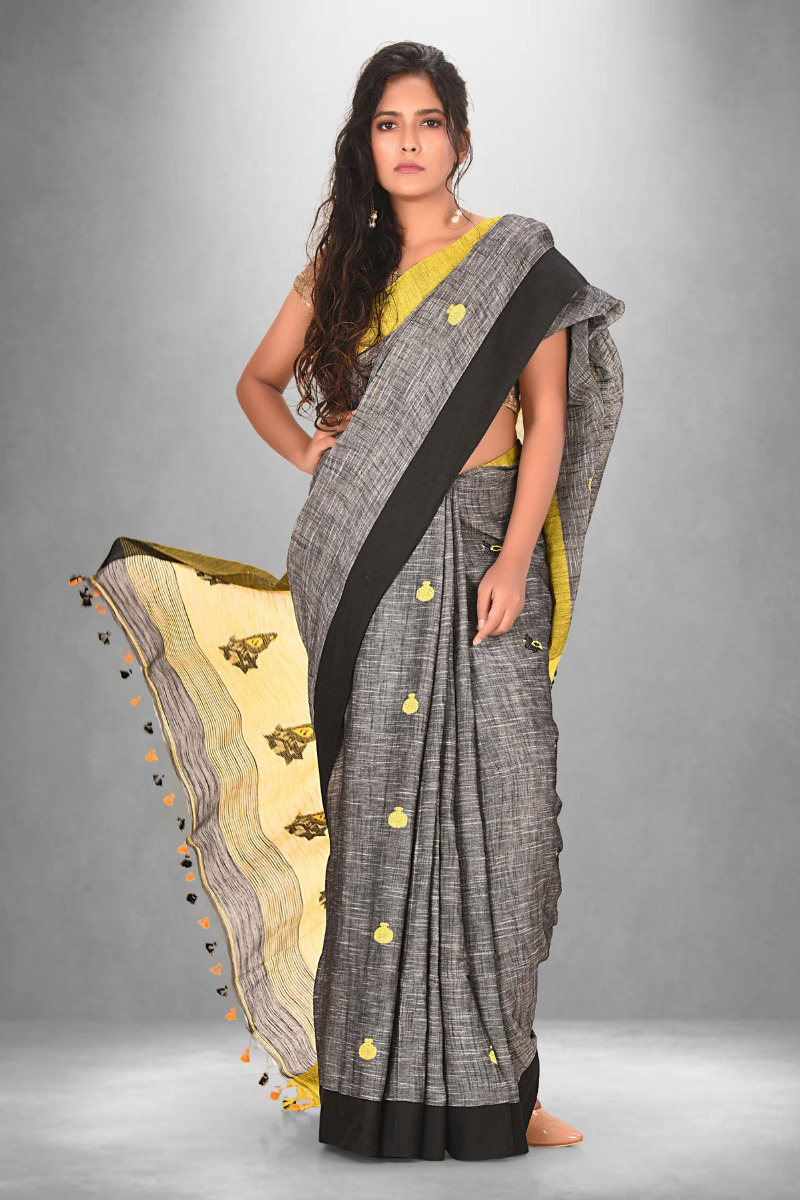 Grey Cotton saree with black border ad yellow motifs
